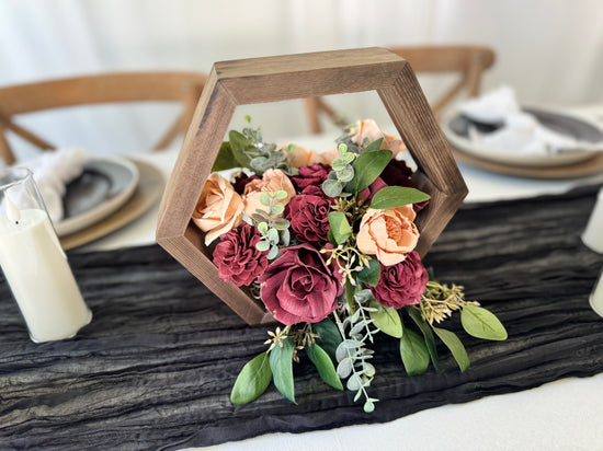 Wood Hexagon wedding centerpiece arrangement with burgundy and peach flowers
