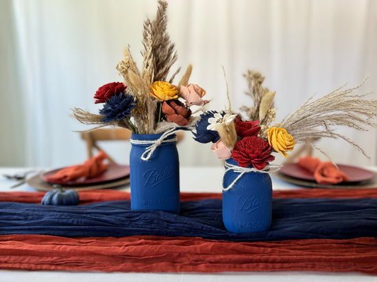 pair of mason jar vases for wedding centerpiece in fall colors such as navy, yellow, peach and red